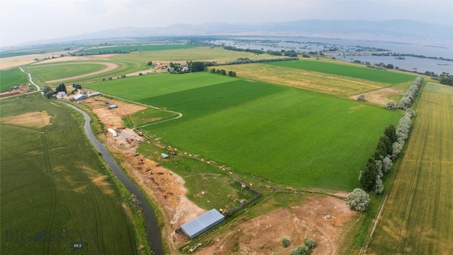 birds eye view of property with a rural view and a water and mountain view