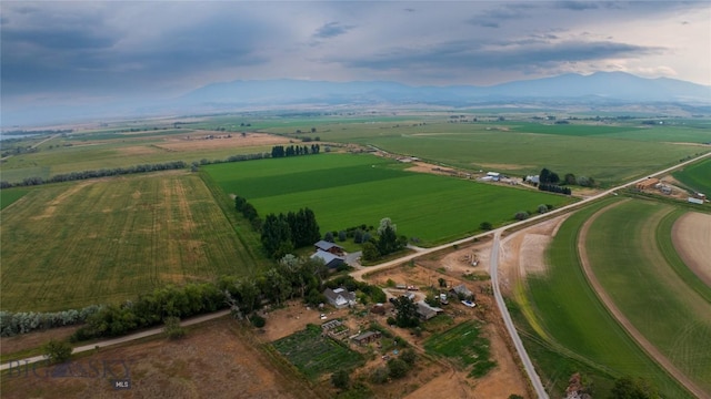 birds eye view of property with a mountain view and a rural view