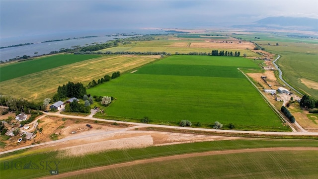 drone / aerial view featuring a water view and a rural view