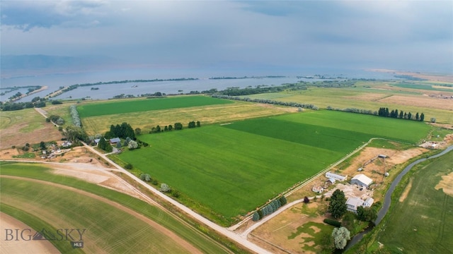 drone / aerial view featuring a water view and a rural view