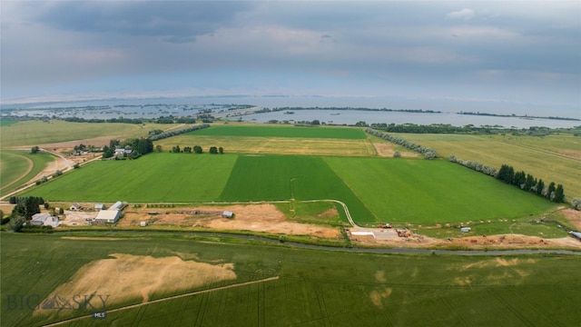 drone / aerial view featuring a water view and a rural view