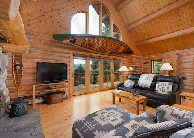 living room with log walls, light hardwood / wood-style flooring, wood ceiling, beam ceiling, and high vaulted ceiling