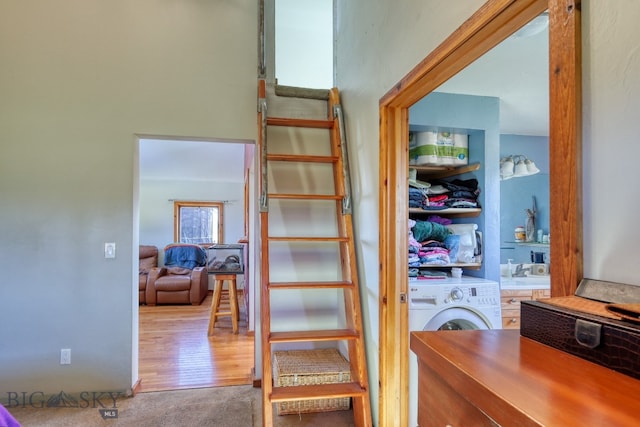 interior space with hardwood / wood-style flooring and independent washer and dryer