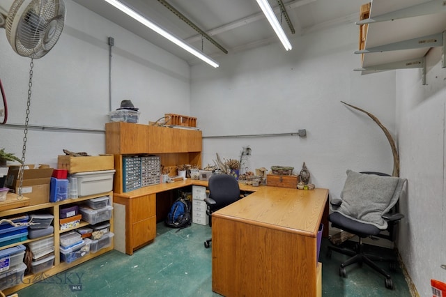 home office featuring concrete flooring