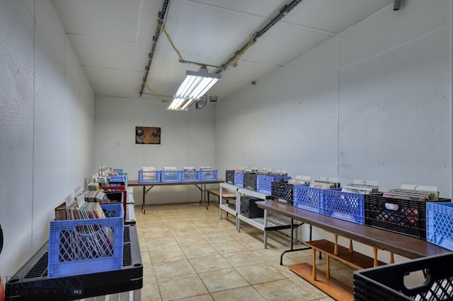 basement featuring light tile patterned floors