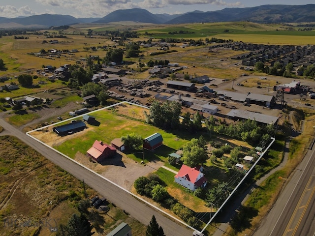 birds eye view of property featuring a mountain view