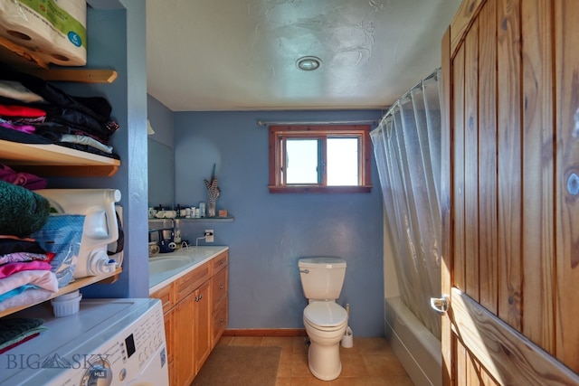 full bathroom with shower / tub combo, tile patterned flooring, washer / clothes dryer, toilet, and vanity