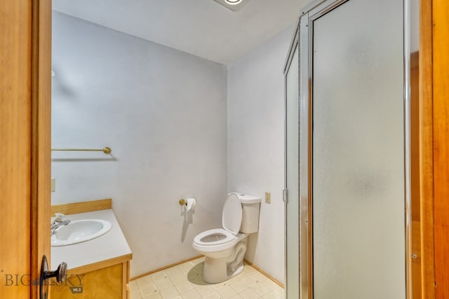 bathroom with tile patterned floors, toilet, and vanity