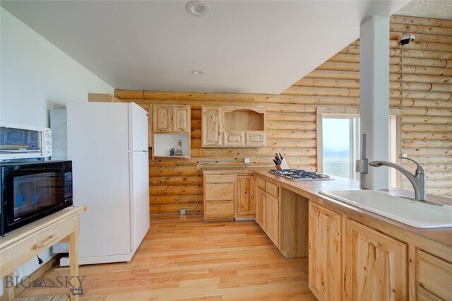 224 Slide Rock Rd, Cameron, MT 59720 - kitchen featuring white appliances, light brown cabinets, rustic walls, light wood-type flooring, and light countertops