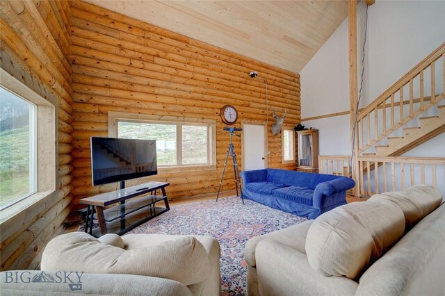 224 Slide Rock Rd, Cameron, MT 59720 - living room featuring rustic walls, high vaulted ceiling, wood ceiling, and stairway