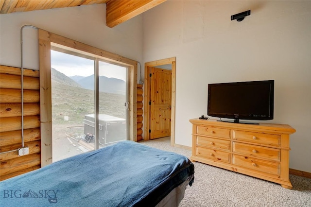 224 Slide Rock Rd, Cameron, MT 59720 - bedroom with carpet floors, rustic walls, lofted ceiling, and access to exterior