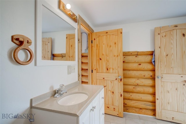 224 Slide Rock Rd, Cameron, MT 59720 - bathroom featuring rustic walls, tile patterned floors, and vanity