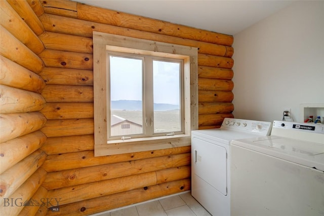 224 Slide Rock Rd, Cameron, MT 59720 - laundry room featuring separate washer and dryer, laundry area, light tile patterned floors, and log walls