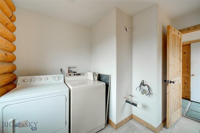 224 Slide Rock Rd, Cameron, MT 59720 - clothes washing area featuring light tile patterned floors, laundry area, and washer and dryer