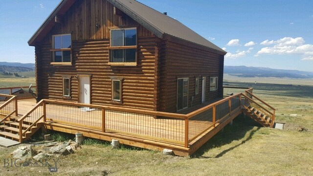 224 Slide Rock Rd, Cameron, MT 59720 - rear view of house featuring log exterior and a deck with mountain view