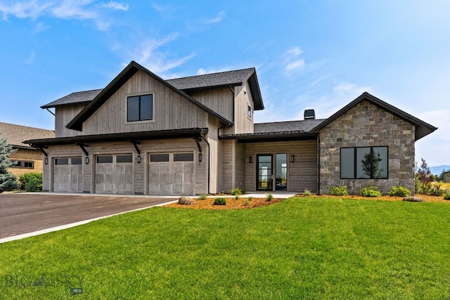 20 Bold Driver Ln, Bozeman, MT 59718 - view of front of house with driveway, a front lawn, stone siding, and a chimney