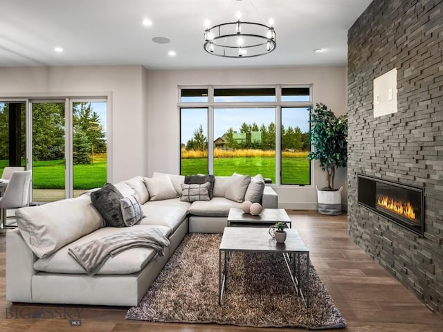 20 Bold Driver Ln, Bozeman, MT 59718 - living area featuring a fireplace, wood finished floors, plenty of natural light, recessed lighting, and a chandelier