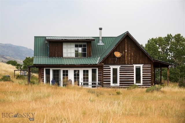 rear view of house with a mountain view