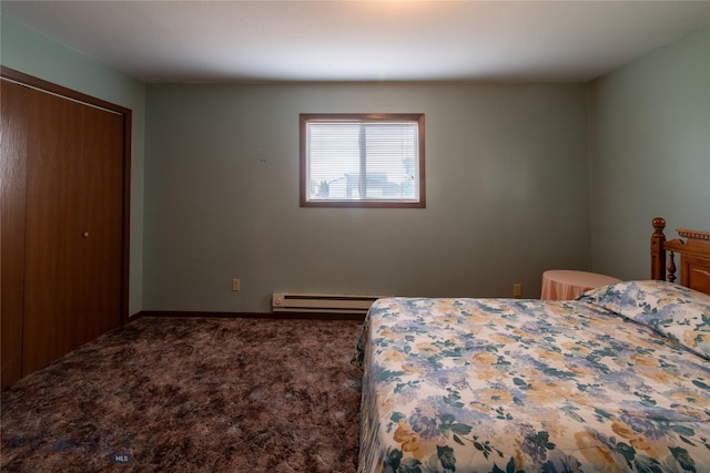 carpeted bedroom featuring a baseboard heating unit and a closet