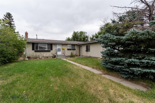 ranch-style house with a front lawn