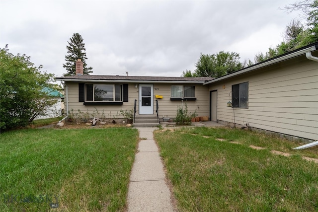 single story home with a front lawn