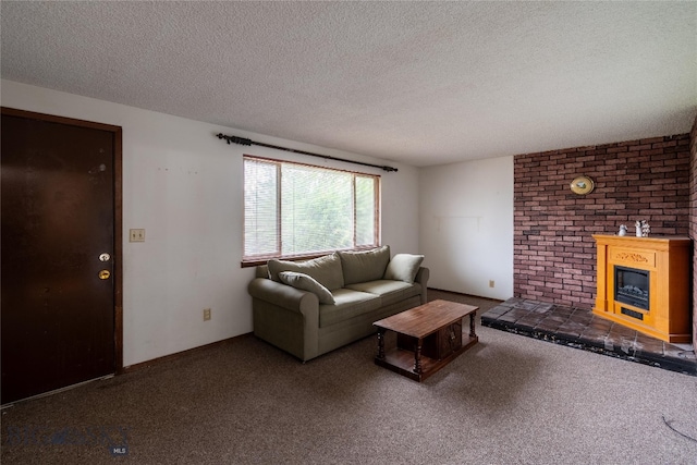 living room featuring a fireplace, a textured ceiling, and dark carpet