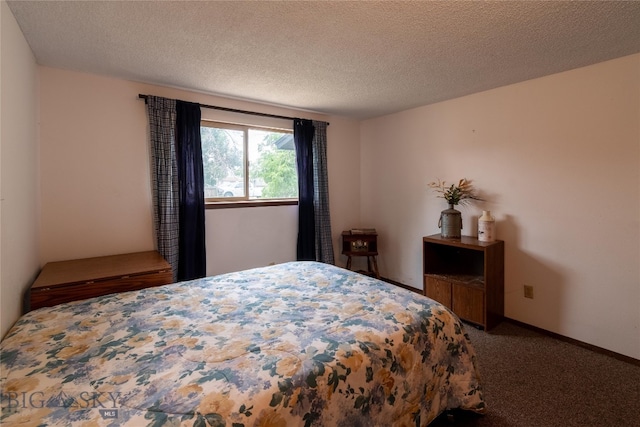 carpeted bedroom featuring a textured ceiling