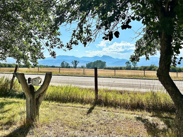 mountain view featuring a rural view