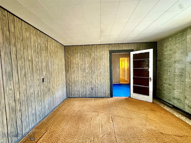 empty room with wooden walls