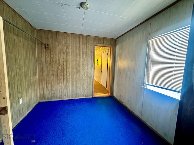 empty room with wooden walls