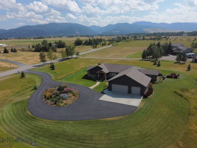 birds eye view of property featuring a mountain view and a rural view