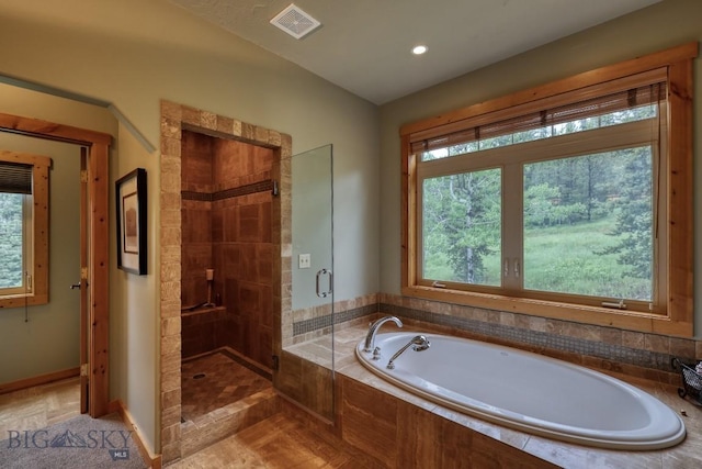 83 W Pine Cone Ter, Big Sky, MT 59716 - full bathroom with plenty of natural light, a garden tub, a stall shower, and recessed lighting