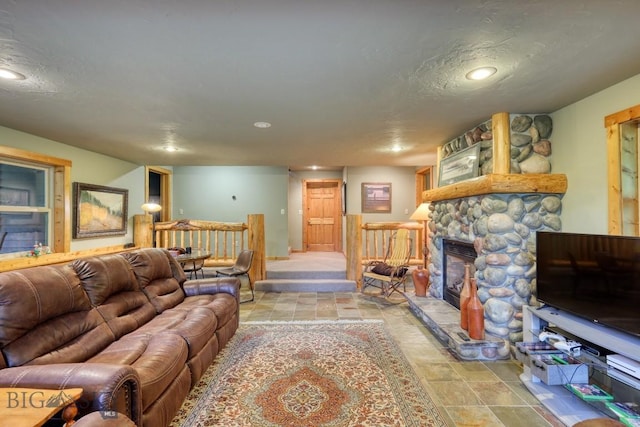 83 W Pine Cone Ter, Big Sky, MT 59716 - living room with a fireplace, recessed lighting, and stone finish floors