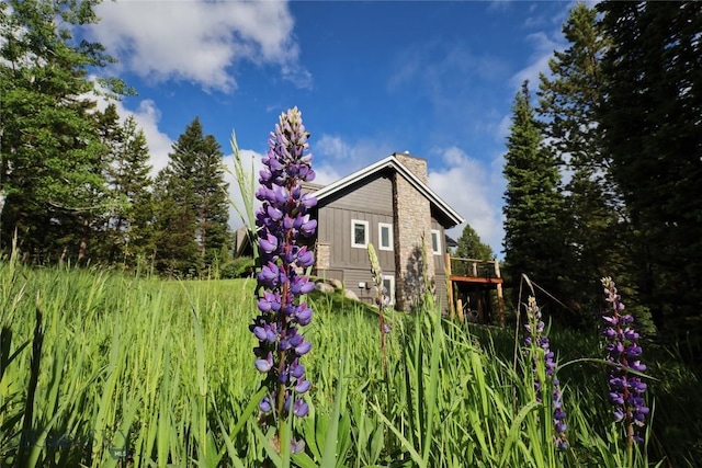 83 W Pine Cone Ter, Big Sky, MT 59716 - view of side of home featuring a chimney