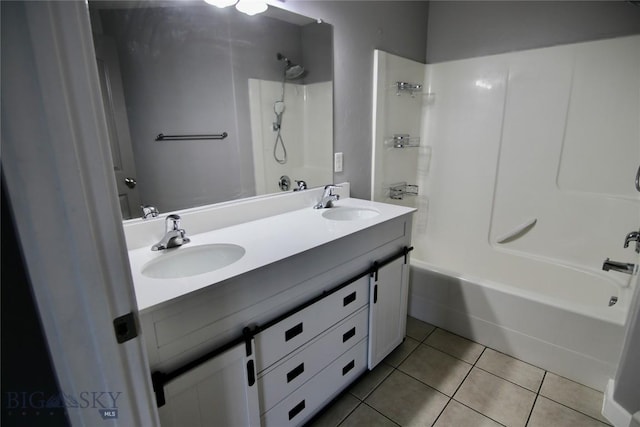 full bathroom featuring double vanity, a sink, shower / bathing tub combination, and tile patterned floors