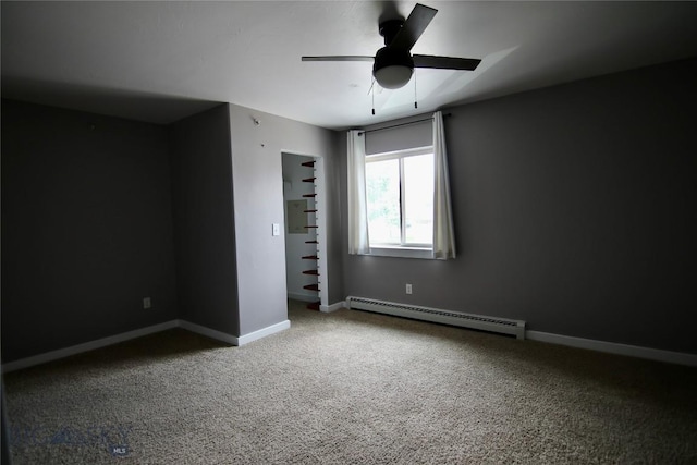 unfurnished bedroom with a baseboard heating unit, carpet, ceiling fan, and baseboards