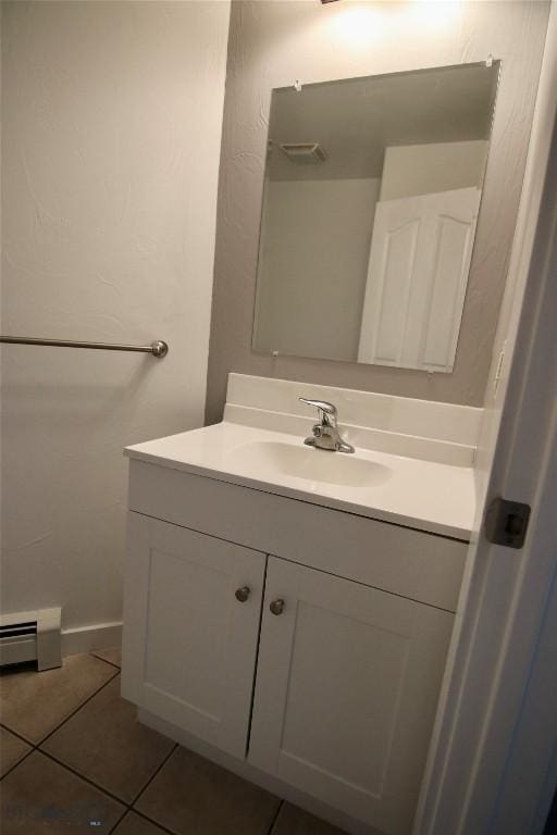 bathroom featuring a baseboard radiator, vanity, and tile patterned floors