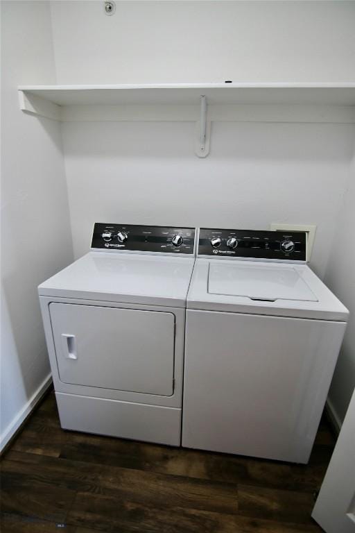 laundry room featuring laundry area, baseboards, washer and clothes dryer, and dark wood-style flooring