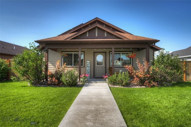 bungalow featuring a porch and a front yard