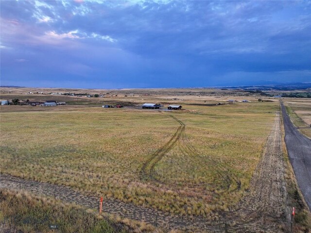 birds eye view of property featuring a rural view