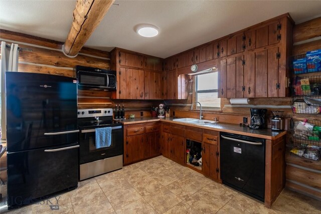 kitchen with beamed ceiling, sink, black appliances, and log walls