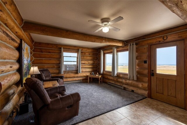 unfurnished room with baseboard heating, beamed ceiling, a textured ceiling, and ceiling fan