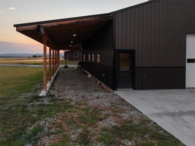 property exterior at dusk with a carport