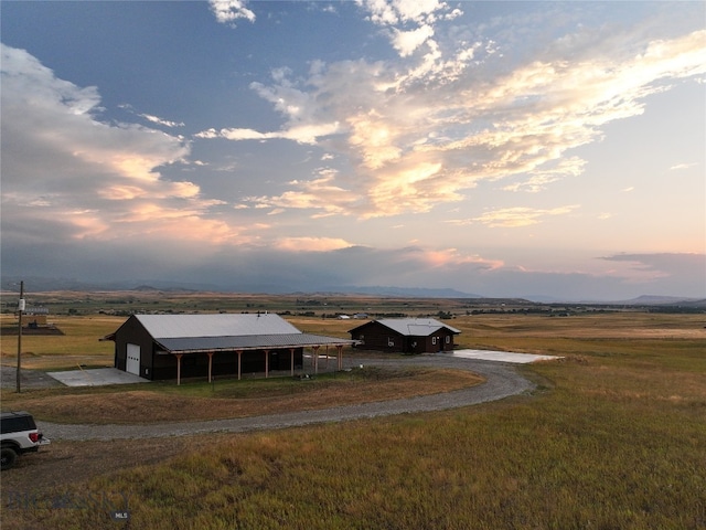 view of front of house with a rural view