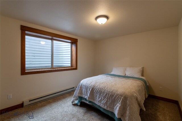 carpeted bedroom featuring a baseboard radiator