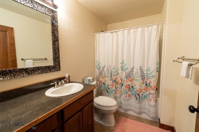 full bathroom with toilet, shower / bathtub combination with curtain, and vanity