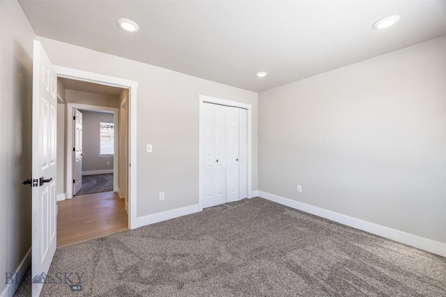 unfurnished bedroom with carpet floors and a closet