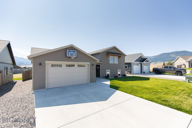 view of front facade with a mountain view and a front lawn