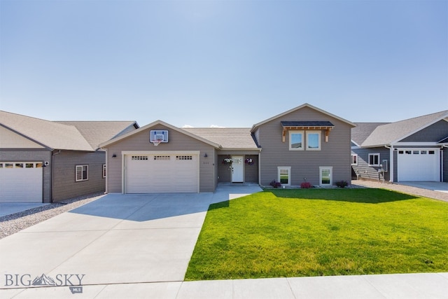 view of front of house featuring a garage and a front yard