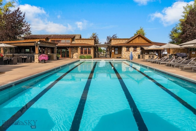 view of swimming pool featuring a patio